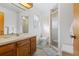 Clean bathroom with shower, toilet and wood vanity at 1565 Piedmont Rd, Venice, FL 34293