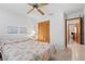 Bedroom with a queen bed, ceiling fan, and dresser at 1565 Piedmont Rd, Venice, FL 34293