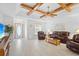 Bright living room featuring a view to the kitchen and front entrance at 1565 Piedmont Rd, Venice, FL 34293