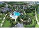 Aerial view of community pool, clubhouse and landscaping at 21205 Holmes Cir, Venice, FL 34293