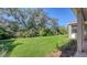 Landscaped backyard with lush green grass at 21205 Holmes Cir, Venice, FL 34293