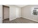 Bright bedroom with wood-look floors and window at 21205 Holmes Cir, Venice, FL 34293