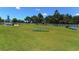 Dog park with agility equipment and shaded areas at 21205 Holmes Cir, Venice, FL 34293