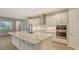 Modern kitchen with stainless steel appliances and large island at 21205 Holmes Cir, Venice, FL 34293