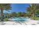 Resort-style pool with palm trees and lounge chairs at 21205 Holmes Cir, Venice, FL 34293