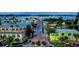 Aerial view of a waterfront town with colorful buildings and boats at 4234 Gulf Of Mexico Dr # Y2, Longboat Key, FL 34228