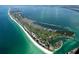 Aerial view of a coastal community with golf course and oceanfront homes at 4234 Gulf Of Mexico Dr # Y2, Longboat Key, FL 34228