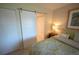 Bedroom with white sliding door leading to a closet at 4234 Gulf Of Mexico Dr # Y2, Longboat Key, FL 34228