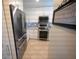 Modern kitchen with stainless steel appliances and white cabinets at 4234 Gulf Of Mexico Dr # Y2, Longboat Key, FL 34228