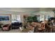 Bright living room features comfortable leather furniture at 4234 Gulf Of Mexico Dr # Y2, Longboat Key, FL 34228