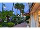 Evening street scene with palm trees, shops and pedestrians at 4234 Gulf Of Mexico Dr # Y2, Longboat Key, FL 34228