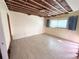 Large bedroom with tiled floors and window at 23 Seaside Ct, Holmes Beach, FL 34217