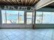 Bright living room, tiled floor, and stunning water views at 23 Seaside Ct, Holmes Beach, FL 34217
