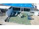Quaint patio with seating area, adjacent to waterfront home at 23 Seaside Ct, Holmes Beach, FL 34217