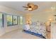 Spacious bedroom with a king-size bed and large window at 6705 Grand Estuary Trl # 206, Bradenton, FL 34212