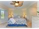 Main bedroom with a king-size bed and ceiling fan at 6705 Grand Estuary Trl # 206, Bradenton, FL 34212