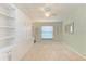 Bedroom with built-in shelving and a murphy bed at 6705 Grand Estuary Trl # 206, Bradenton, FL 34212