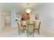 Bright dining room with a glass-top table and seating for four at 6705 Grand Estuary Trl # 206, Bradenton, FL 34212