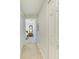 Hallway with tile flooring and access to bedrooms at 6705 Grand Estuary Trl # 206, Bradenton, FL 34212
