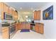 Modern kitchen with stainless steel appliances and granite countertops at 6705 Grand Estuary Trl # 206, Bradenton, FL 34212
