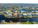 Aerial view of waterfront home with canal access to Charlotte Harbor at 1732 Boca Raton Ct, Punta Gorda, FL 33950