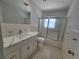 Bathroom with updated vanity and shower at 1732 Boca Raton Ct, Punta Gorda, FL 33950