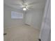 Spacious bedroom with ceiling fan and double closets at 1732 Boca Raton Ct, Punta Gorda, FL 33950