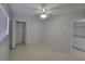 Bedroom with ceiling fan and built-in shelving at 1732 Boca Raton Ct, Punta Gorda, FL 33950