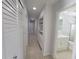 Bright hallway with built-in shelving and closets at 1732 Boca Raton Ct, Punta Gorda, FL 33950