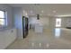 Modern kitchen featuring white shaker cabinets, quartz countertops, and stainless steel appliances at 1732 Boca Raton Ct, Punta Gorda, FL 33950