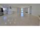 Open living area with terrazzo floors and lots of natural light at 1732 Boca Raton Ct, Punta Gorda, FL 33950