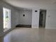 Bright and airy living room with terrazzo flooring at 1732 Boca Raton Ct, Punta Gorda, FL 33950