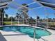 Inviting screened pool with tranquil water views at 1732 Boca Raton Ct, Punta Gorda, FL 33950