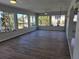 Sunroom with wood-look flooring and water views at 1732 Boca Raton Ct, Punta Gorda, FL 33950