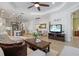 Bright living area with wood floors, white trim, and open layout to the kitchen and dining room at 3028 Sky Blue Cv, Bradenton, FL 34211