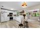 Modern white kitchen with stainless steel appliances at 3415 51St Avenue W Cir # 206, Bradenton, FL 34210