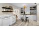 White kitchen with quartz countertops and built-in shelving at 3415 51St Avenue W Cir # 206, Bradenton, FL 34210