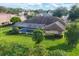 Aerial view of a house with a screened-in pool and spacious green backyard at 4918 Fallcrest Cir, Sarasota, FL 34233