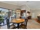 Charming dining area with views of the patio and access to the modern kitchen at 4918 Fallcrest Cir, Sarasota, FL 34233