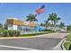 Community entrance with a flag and modern signage at 8721 Ocean Tides Cv, Parrish, FL 34219