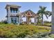 Inviting community entrance with a guardhouse and landscaping at 8721 Ocean Tides Cv, Parrish, FL 34219