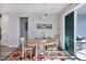 Bright dining room with wood table and colorful rug at 8721 Ocean Tides Cv, Parrish, FL 34219