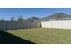 Backyard with vinyl fence and grassy lawn at 12513 Oak Hill Way, Parrish, FL 34219