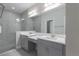 Modern bathroom with double vanity and a large walk-in shower at 12513 Oak Hill Way, Parrish, FL 34219