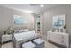 Bedroom with white dresser and light blue bedding at 12513 Oak Hill Way, Parrish, FL 34219