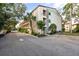 Residential building exterior showcasing architectural details and landscaping at 2280 Stickney Point Rd # 420, Sarasota, FL 34231