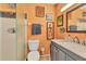 Bathroom with shower, toilet, vanity, and decorative wall art at 2431 Golf Course Dr # 703, Sarasota, FL 34234