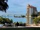 Scenic waterfront view with bridge and modern building at 2431 Golf Course Dr # 703, Sarasota, FL 34234