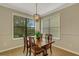 A charming breakfast nook is filled with natural light from large windows at 340 Cedar Falls Dr, Apollo Beach, FL 33572