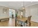 Bright dining area featuring tile floors, elegant lighting, and views to living area at 340 Cedar Falls Dr, Apollo Beach, FL 33572